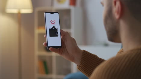 payment accepting process on screen of smartphone in male hands man is paying and shopping online by modern app and service closeup of cell phone