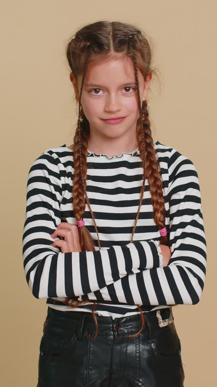 Upset preteen child girl showing thumbs down dislike bad work disapproval dissatisfied feedback