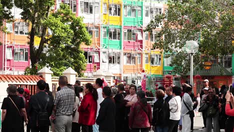 group of tourists exploring hong kong temple