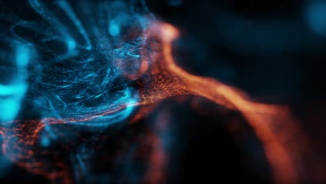 abstract macro slow motion shot of blue and orange particle fluid isolated on black.