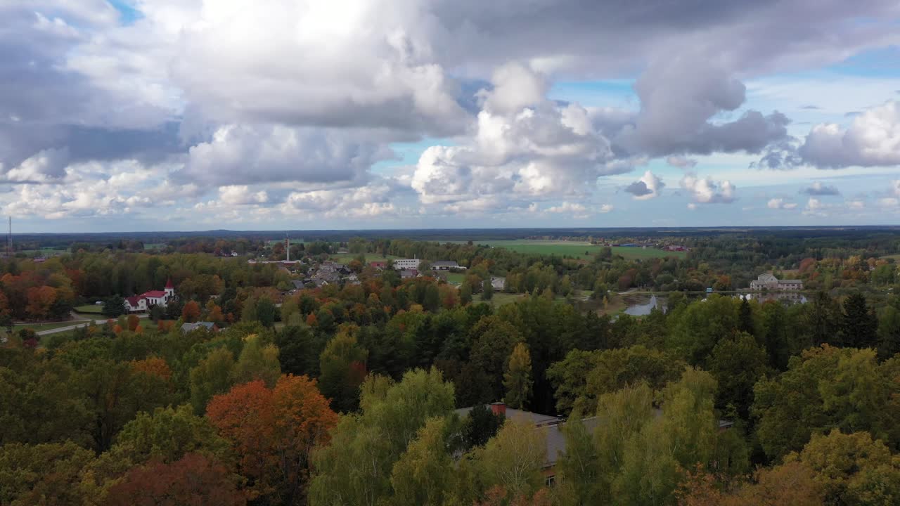 Small town and rural landscape of Easter Europe in Autumn season, aerial ascend view
