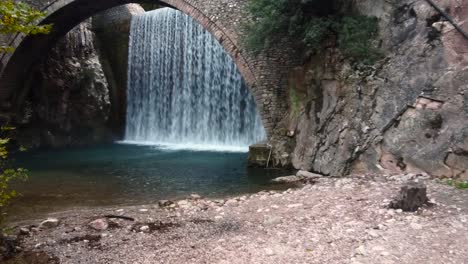 cinematic slow shot of a majestic waterfall