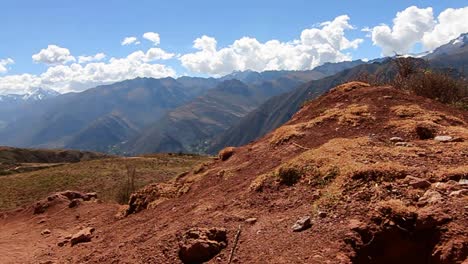 pan from peak to trail with biker