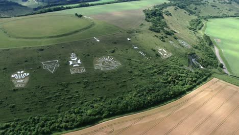 Fovant set of regimental badges carved into chalk hillside aerial view orbiting the historical monument