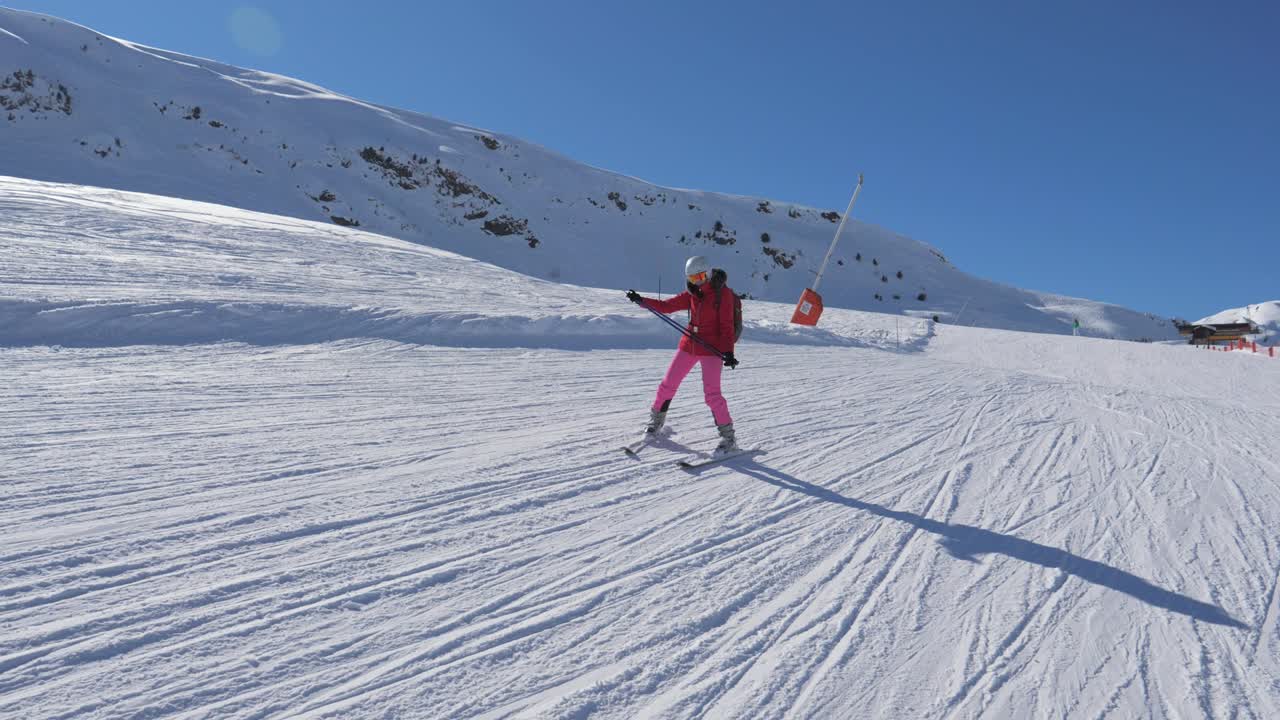 Beginner Skier Skiing Down The Mountain Slope And Learns To Turn Skis