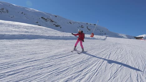 beginner skier skiing down the mountain slope and learns to turn skis