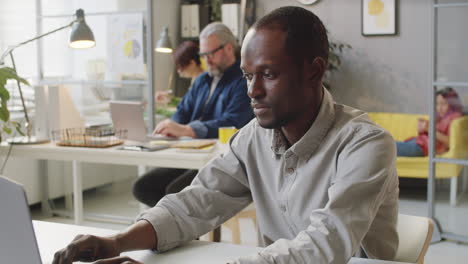 Portrait-of-African-American-Male-Office-Worker-at-Desk