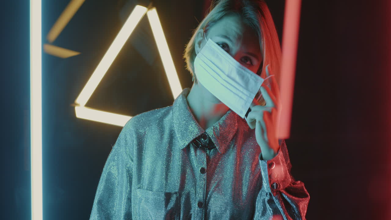 Woman Wearing a Mask in Neon Lights