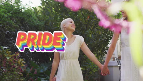 animation of rainbow pride text over diverse female married couple holding hands