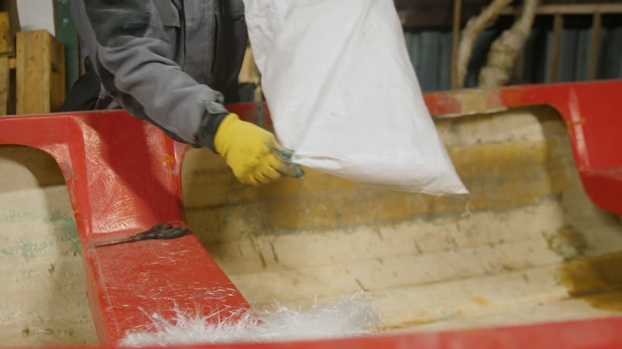 Preparing CSM fiberglass mat for boat repair fabrication