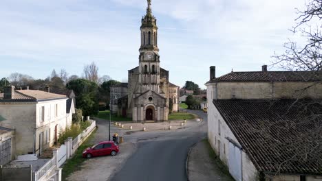 notre-dame church in bayon-sur-gironde, france - aerial flyover