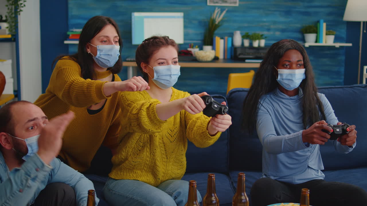 Happy multiethnic group of friends after win at gaming competiton