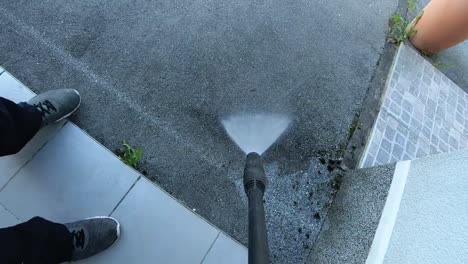 home entrance and driveway cleaning with high-pressure water jet cleaner, slow motion