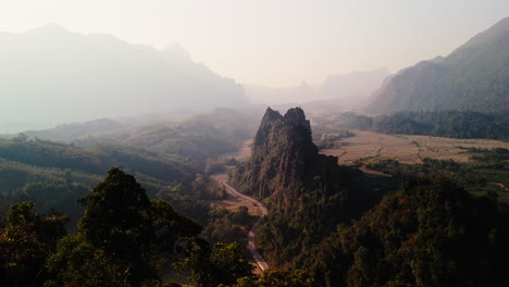 aerial view of a valley with mountains and rice paddies