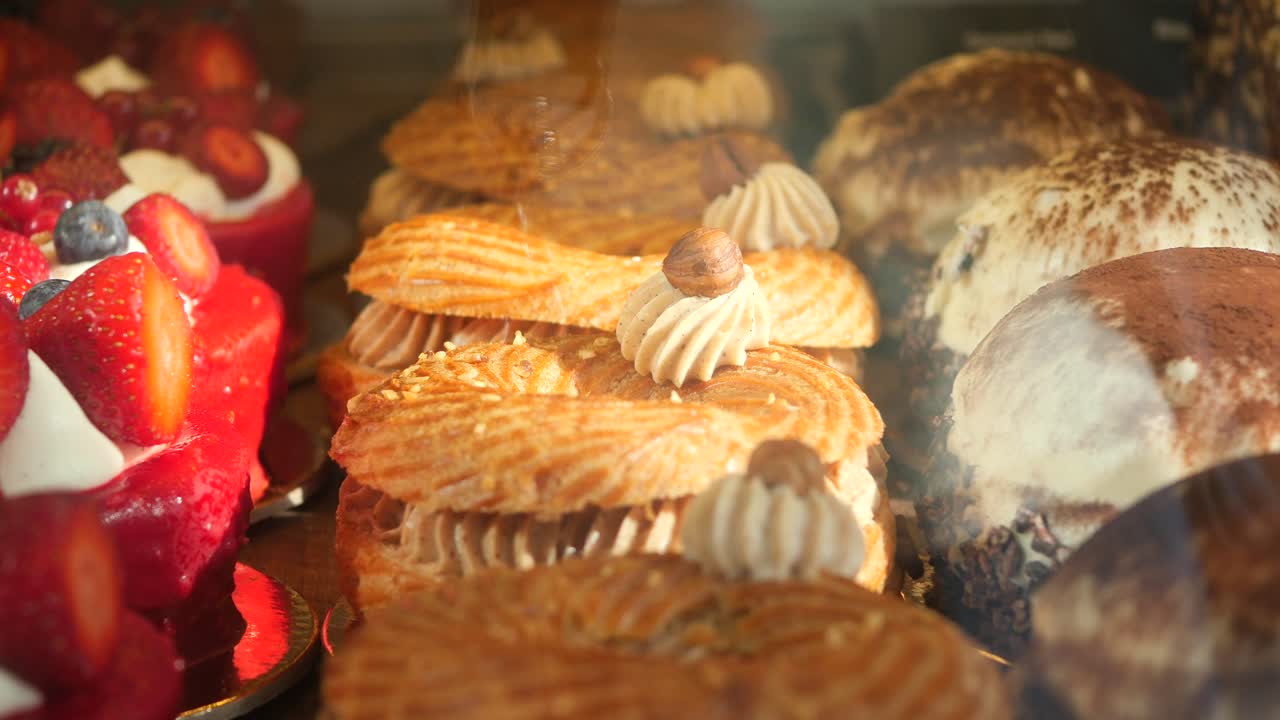 Close-up of assorted pastries and desserts in a display case