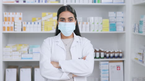 happy pharmacist removing her surgical face mask