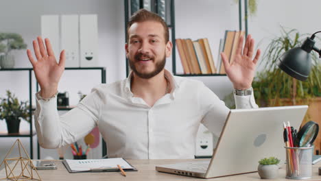 man having a video call in his office