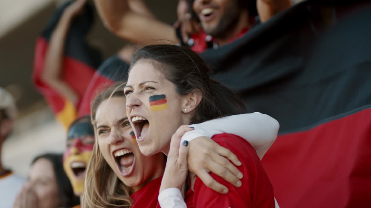 Enthusiastic German fans cheering in game