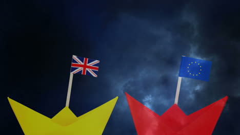 banderas del reino unido y la ue en botes de papel