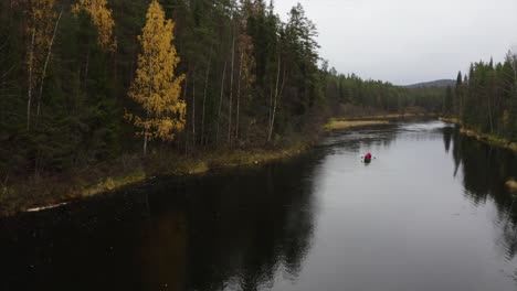 a drone footage of a canoe during autumn