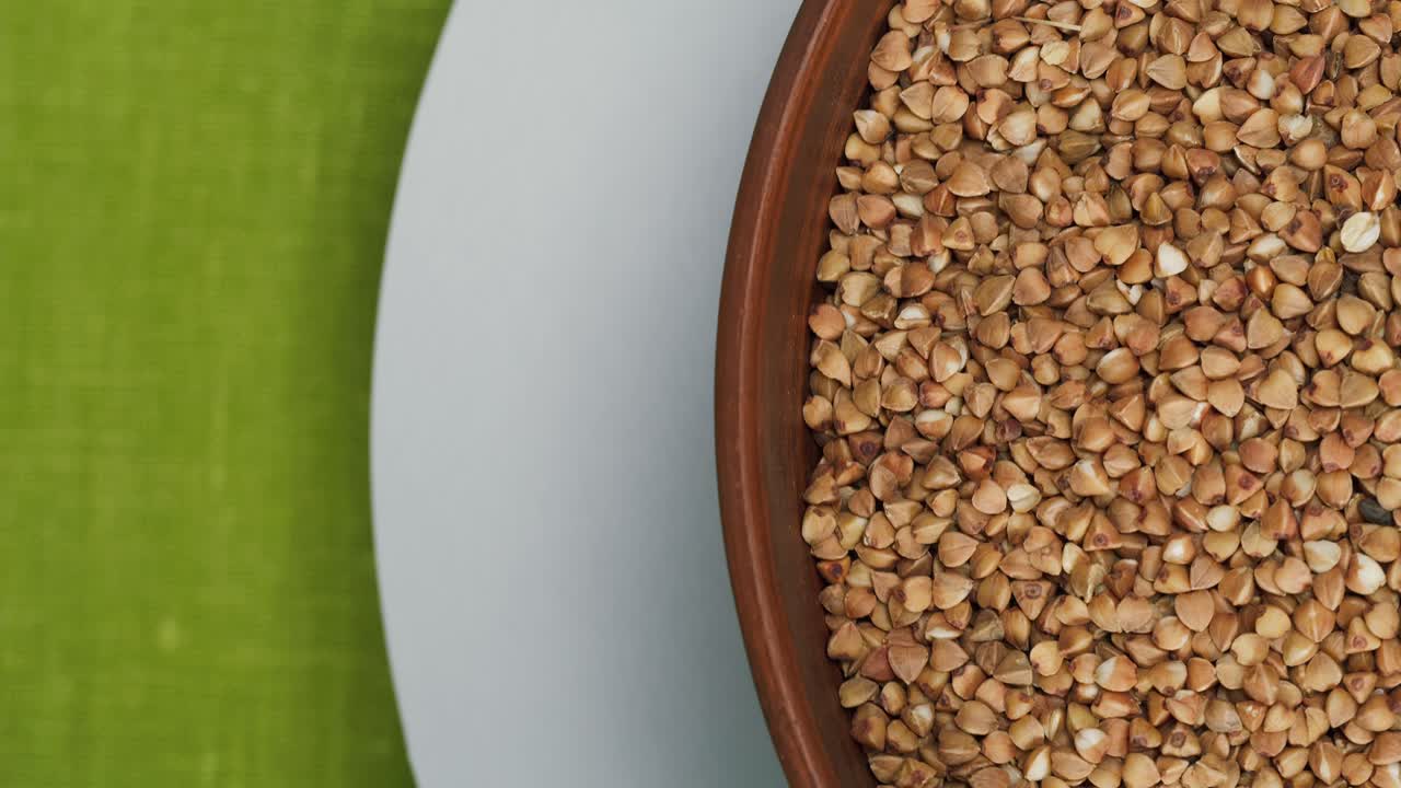 Close-up of Raw Buckwheat Groats in a Brown Bowl