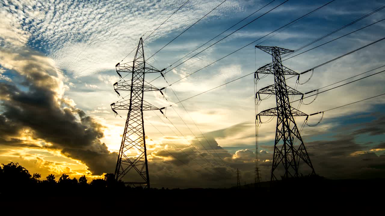 Timelapse silhouette of high voltage electrical pole structure