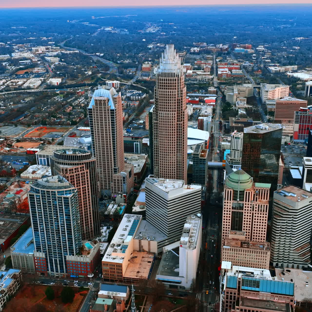 Splendid scenery of Charlotte, North Carolina, USA downtown on cloudy daytime. Distancing from city center with majestic skyscrapers.