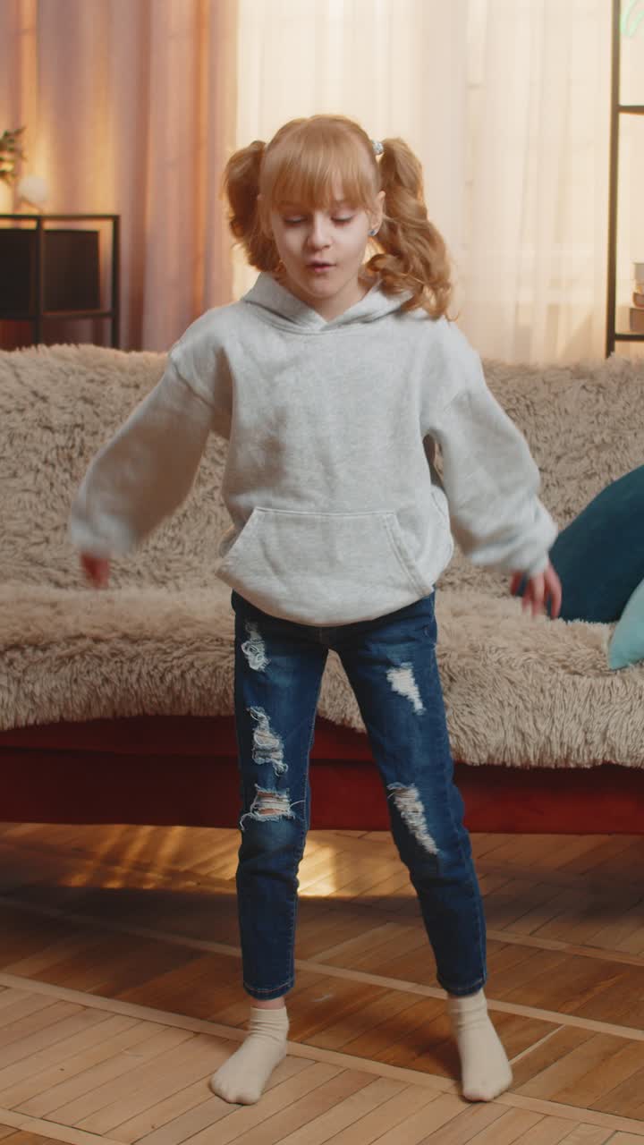 Young teenager girl kid doing easy squat exercise at home counting out loud flop with smile finish