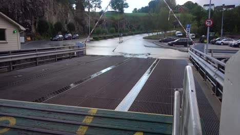 medium shot of a norwegian ferry platform opening and barriers opening