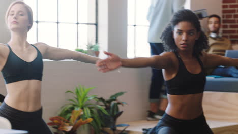 women practicing yoga in a studio