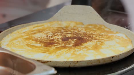 street cook baking a pancake