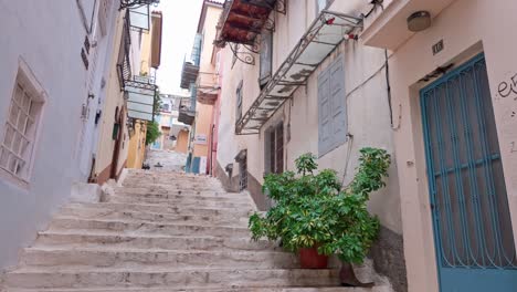 narrow street with stairs in a greek city
