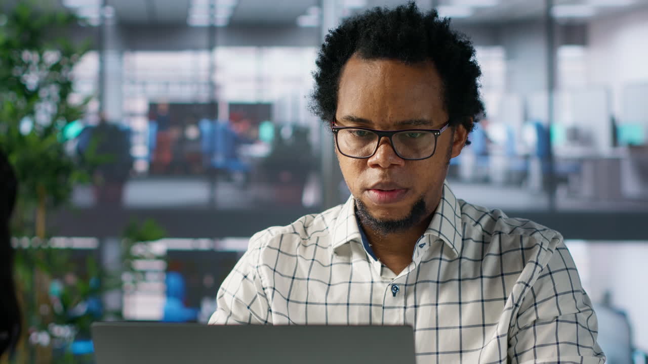 Man working on laptop in office