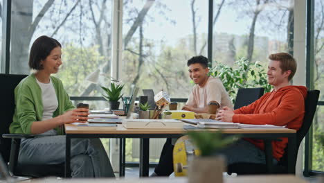 coworkers team communicating coffee break workspace. office colleagues talking