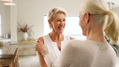 friends, greeting and senior women hug in living