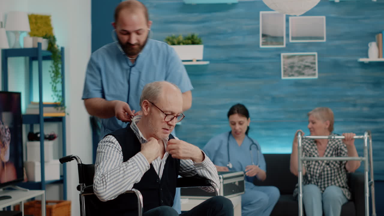 Medical assistant consulting man with stethoscope