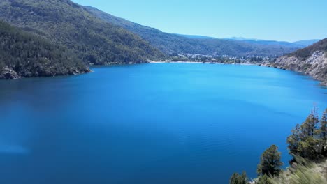 stunning aerial view of a serene lake surrounded by mountains