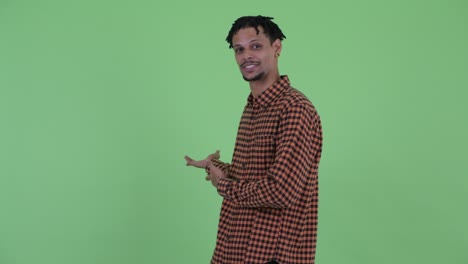 happy young handsome african man with dreadlocks