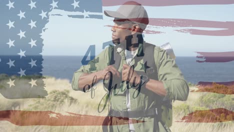 animation of independence day text over african american man hiking