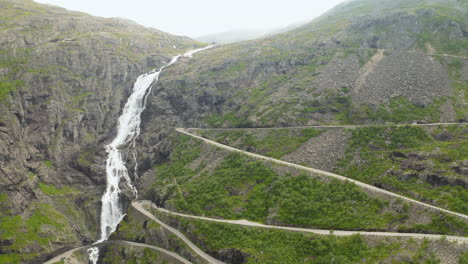 scenic view of the huge waterfall of stigfossen and the tourist route of trollstigen in norway