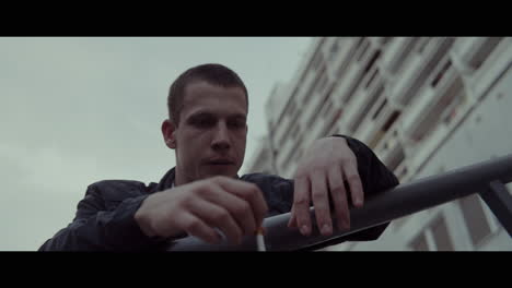Man Smoking in City