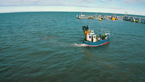 aerial view drone flying around the fishing boat on the sea