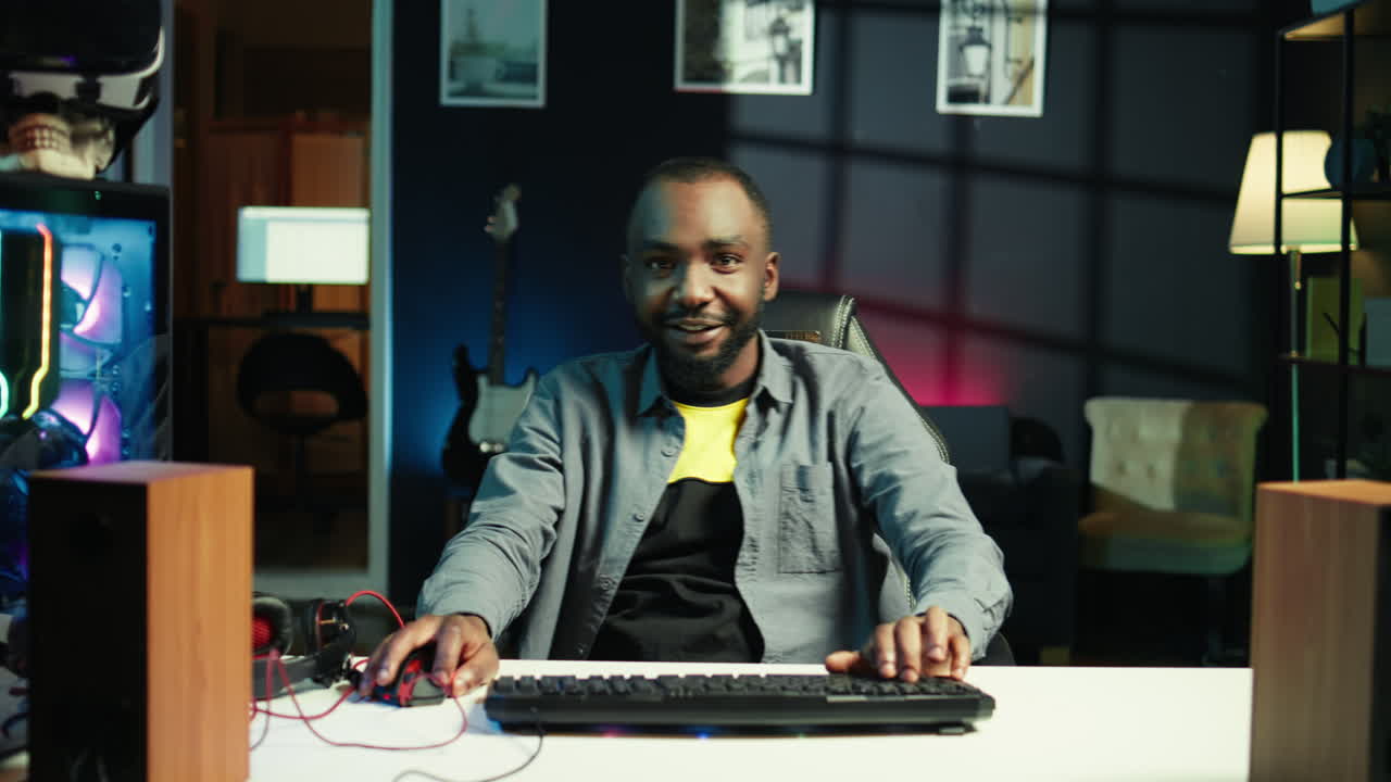 Joyous gamer competing in intense internet multiplayer videogame