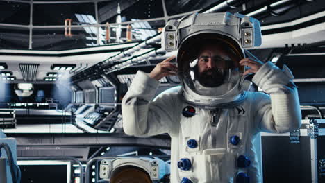 portrait of joyous cosmonaut putting helmet on, preparing for mission launh