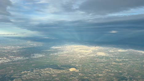 biclical sky over valencia city, spain, shot from an airplane cabin flying at 4000m hifg