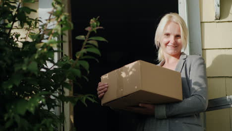 Woman-in-Doorway-With-Parcel