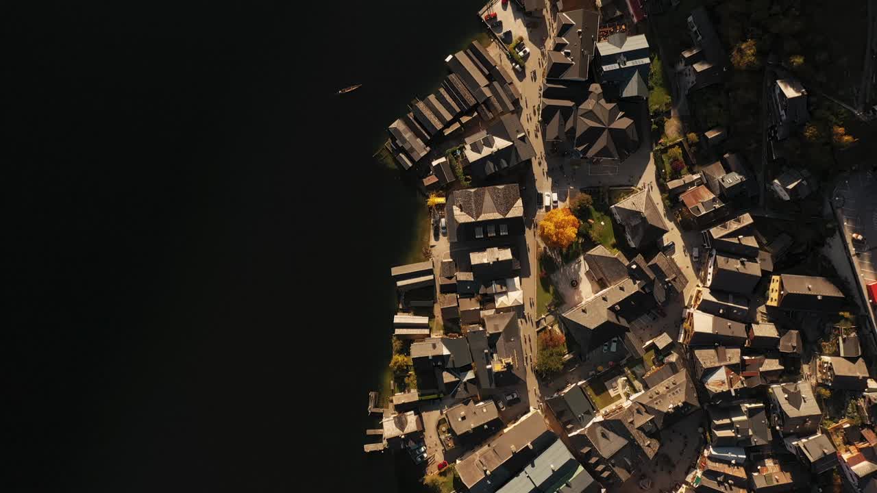 down facing Aerial view over Hallstatt Austria during autumn season, above Hallstatt during fall sunset, beautiful city of Hallstatt during autumn season from fall season