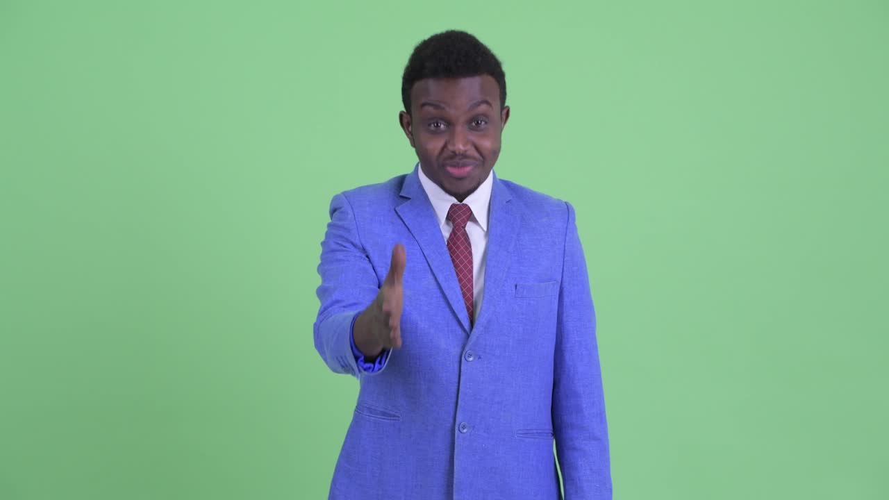 Young African businessman with Afro hair in suit