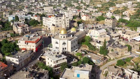 aerial view over hamas golden dome mosque in palestine town biddu,near jerusalem