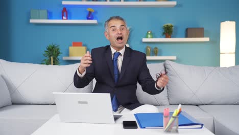 home office worker man says wow to camera.